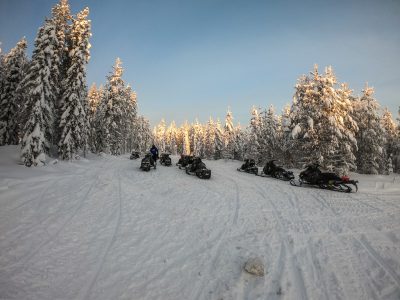 Snowmobiles in the mountains – winter attraction in Rovaniemi, Finland